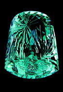Unconventional techniques such as concave and negative faceting juxtapose holographic effects against brilliance and scintillation in this 52-carat aquamarine gem sculpture by Larry Winn 7Photo: Helen Constantine Shull